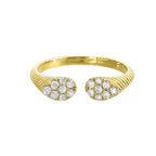 This exquisitely textured yellow gold ring is a royal masterpiece. Its band tapers towards two pear-shaped diamond clusters, converging to create a profile that captures the essence of regal charm.