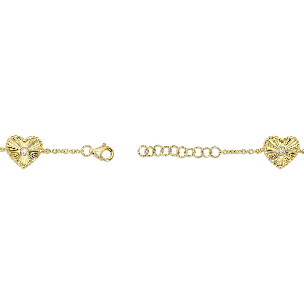 0.10CT 14K Y/G DIAMOND BEZEL RIBBED HEART BRACELET