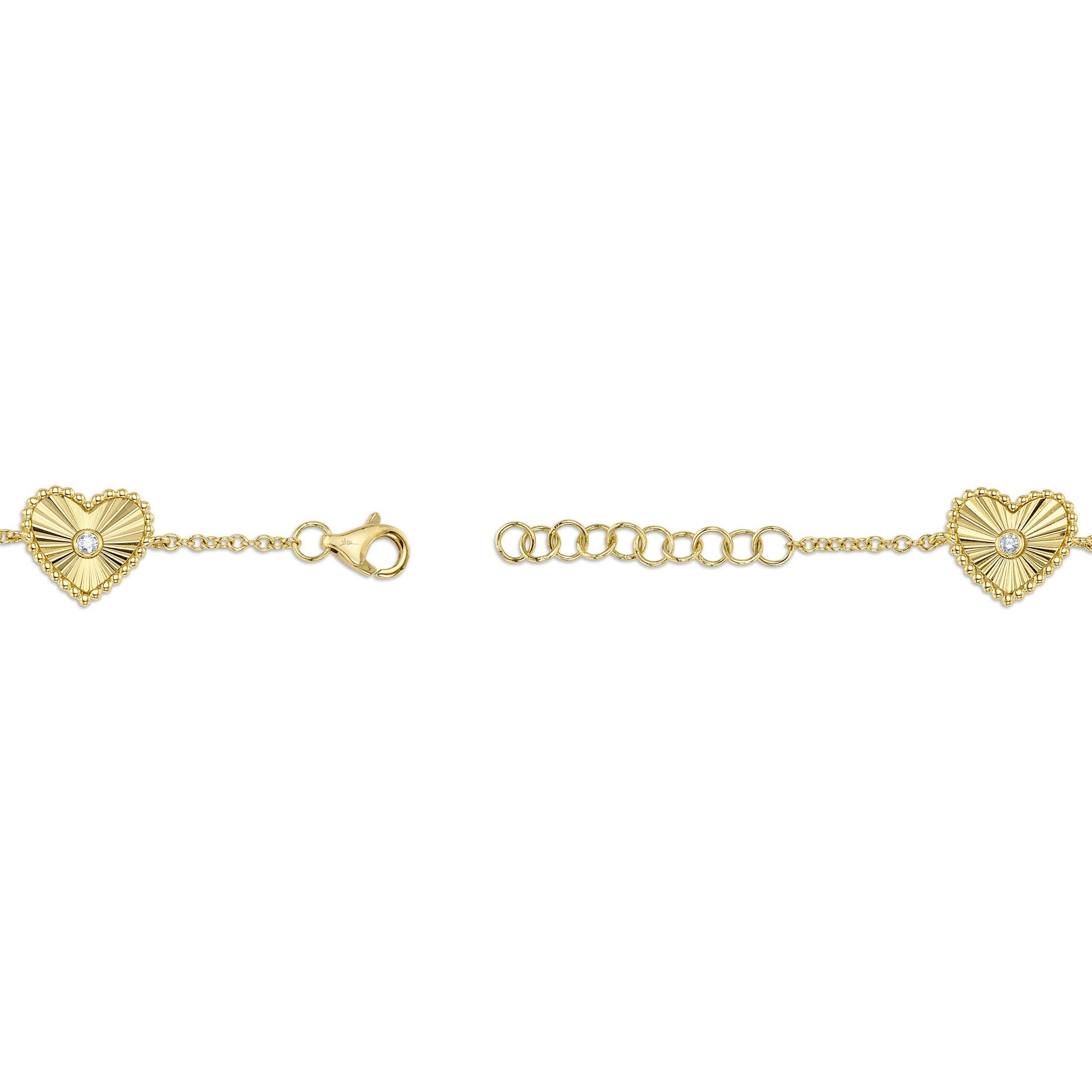 0.10CT 14K Y/G DIAMOND BEZEL RIBBED HEART BRACELET