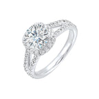 Cushion halo is a stunning way to showcase the round solitaire diamond. Modern split diamond studded shank further highlights the center.