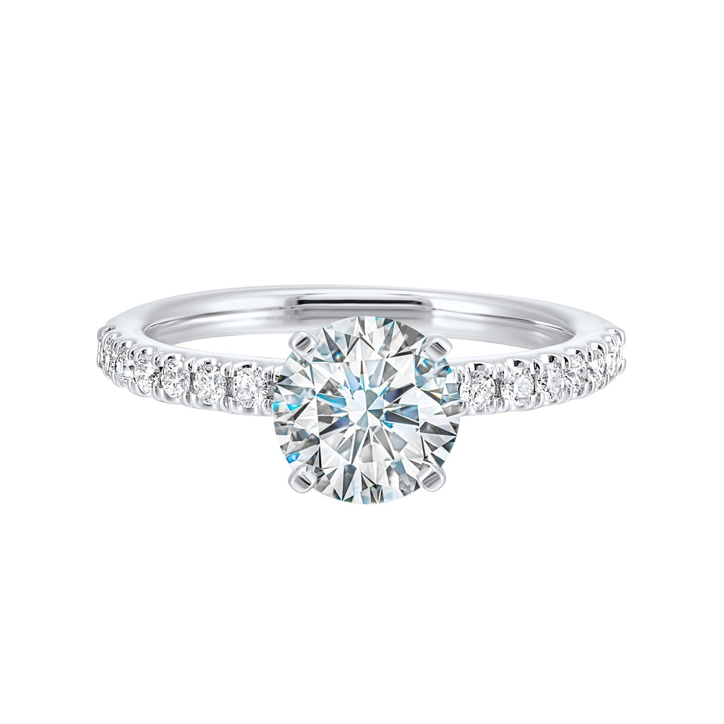 Classic and ready to make you shine, this ring features diamonds set in pave with a center solitaire.