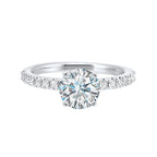 Classic and ready to make you shine, this ring features diamonds set in pave with a center solitaire.