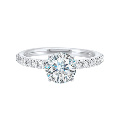 Classic and ready to make you shine, this ring features diamonds set in pave with a center solitaire.