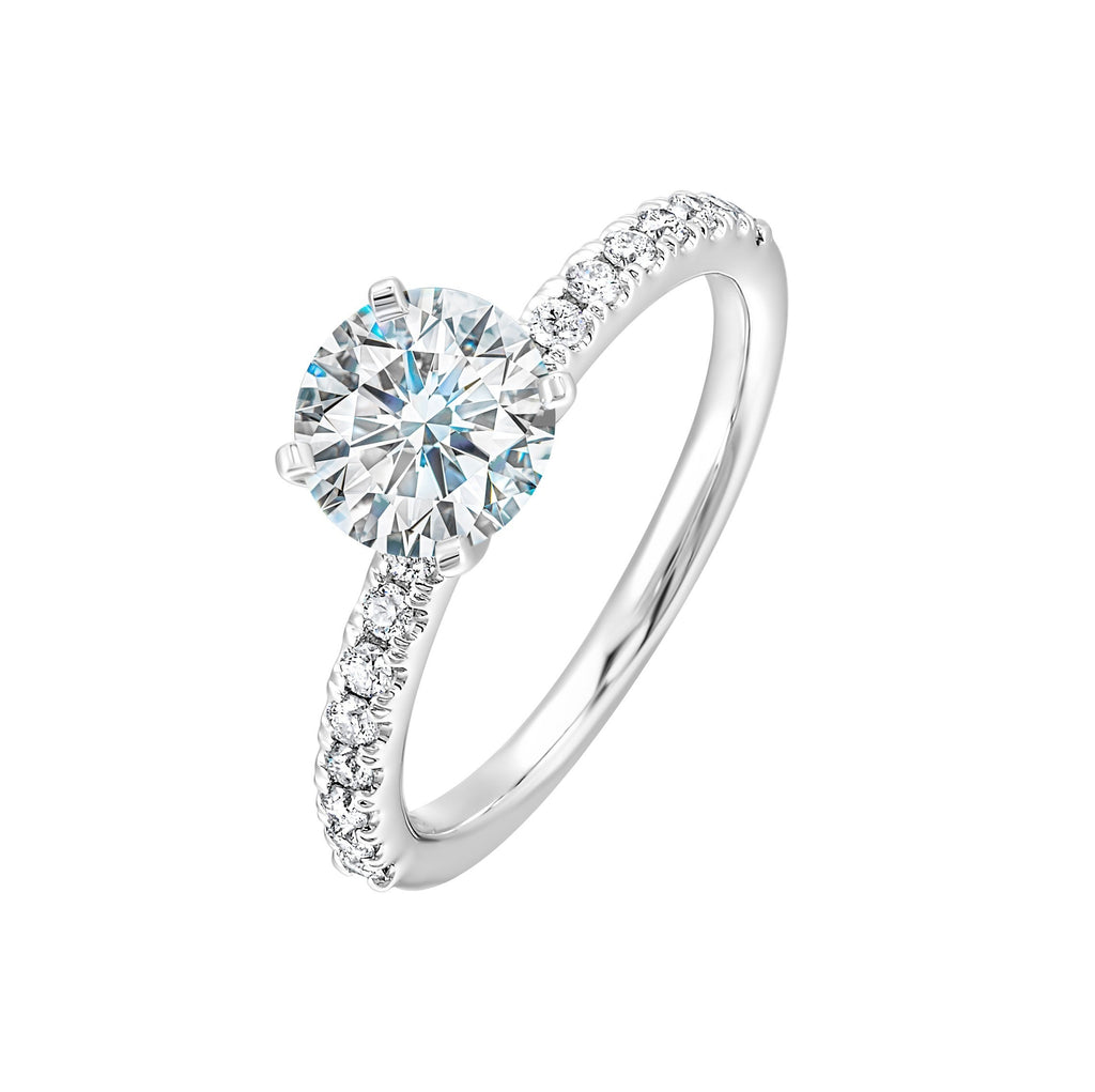 Classic and ready to make you shine, this ring features diamonds set in pave with a center solitaire.