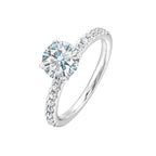 Classic and ready to make you shine, this ring features diamonds set in pave with a center solitaire.