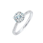 Petite set diamonds adds excitement to this classic solitaire ring perfectly showcases timeless love for her.