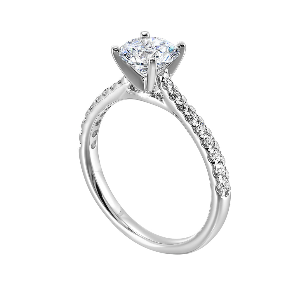 Petite set diamonds adds excitement to this classic solitaire ring perfectly showcases timeless love for her.