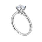 Petite set diamonds adds excitement to this classic solitaire ring perfectly showcases timeless love for her.