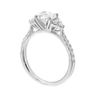 A trio of round diamonds on either side of the solitaire followed by a diamond studded shank, this ring is sure to impress her.