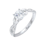 Embraced by a criss cross shank of pave diamonds. Two marquise diamond crown the band, adding a touch of unexpected elegance and a modern twist to this solitaire ring.