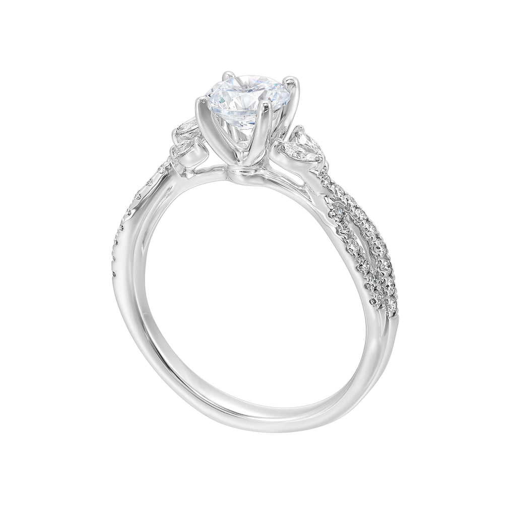 Embraced by a criss cross shank of pave diamonds. Two marquise diamond crown the band, adding a touch of unexpected elegance and a modern twist to this solitaire ring.