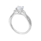 Embraced by a criss cross shank of pave diamonds. Two marquise diamond crown the band, adding a touch of unexpected elegance and a modern twist to this solitaire ring.