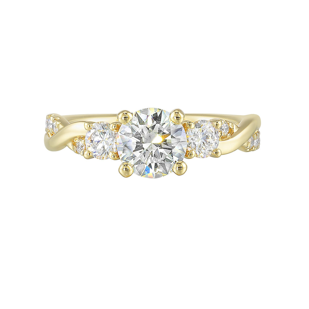 Gorgeous three stone ring features a round solitaire with one smaller diamond on either side. All of this sits a top a criss cross band with playful flow of diamond is a perfect choice.