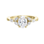 Elongated oval diamond takes center stage, framed by graceful trinity of marquise diamonds set on either side followed by a pinch shank is sure to flatten her.