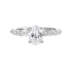 A magnificent oval diamond takes center stage, framed by a breathtaking alternation of fancy and round diamonds is sure to delight her.