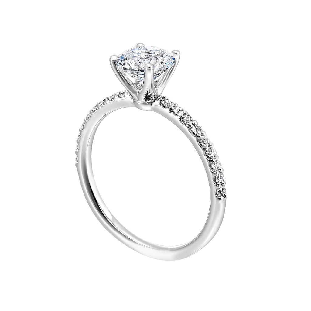This solitaire ring boasts a dazzling micro pave on shank, offering sparkle to this delicate design offers timeless look.