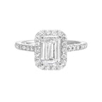A beautiful emerald cut solitaire set with halo of round diamonds and a diamond studded shank makes this perfect choice of your love story.