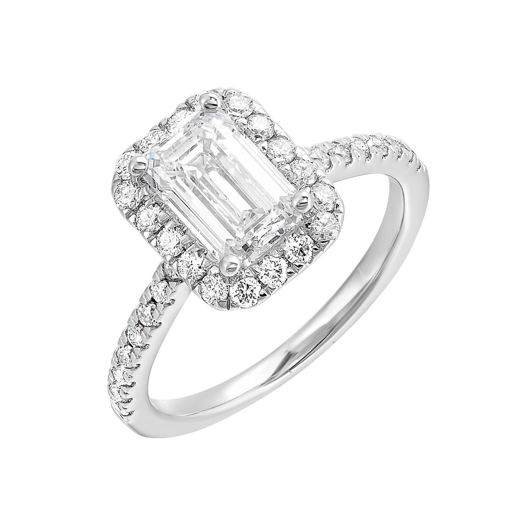 A beautiful emerald cut solitaire set with halo of round diamonds and a diamond studded shank makes this perfect choice of your love story.