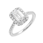 A beautiful emerald cut solitaire set with halo of round diamonds and a diamond studded shank makes this perfect choice of your love story.
