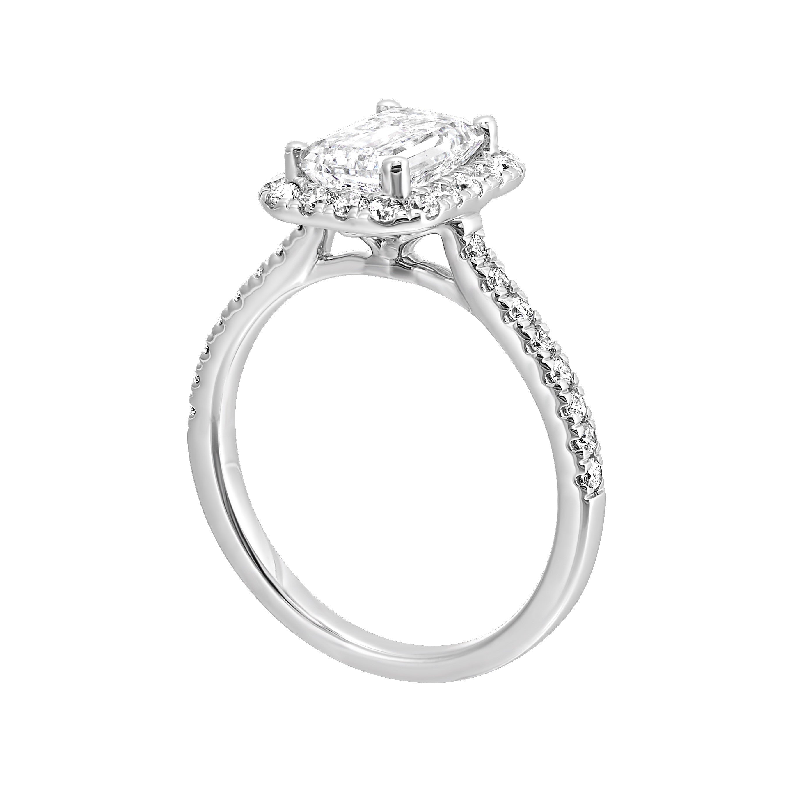 A beautiful emerald cut solitaire set with halo of round diamonds and a diamond studded shank makes this perfect choice of your love story.