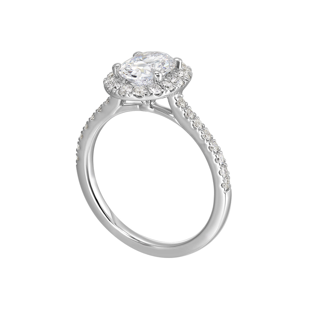 Oval solitaire halo ring with sleek diamond studded shank, this design offers a romantic look for your special moments.