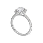 Oval solitaire halo ring with sleek diamond studded shank, this design offers a romantic look for your special moments.