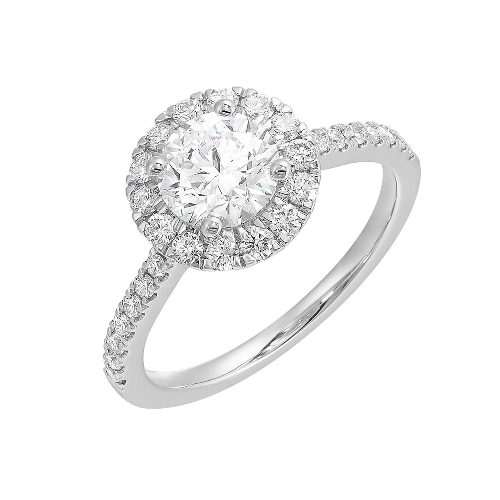 Dazzle with classic round solitaire framed by a sparkling halo. The studded shank adds a touch of classic look, making this ring a timeless symbol of elegance.