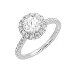 Dazzle with classic round solitaire framed by a sparkling halo. The studded shank adds a touch of classic look, making this ring a timeless symbol of elegance.