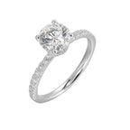 Shine from every angle with this gorgeous round solitaire hidden halo engagement ring. This timeless design offers elegance making it everlasting symbol of your love.