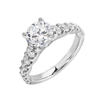 A classic round solitaire elevated by a graduating diamond shank set in common prong offers timeless elegance. Is perfect for your love story.