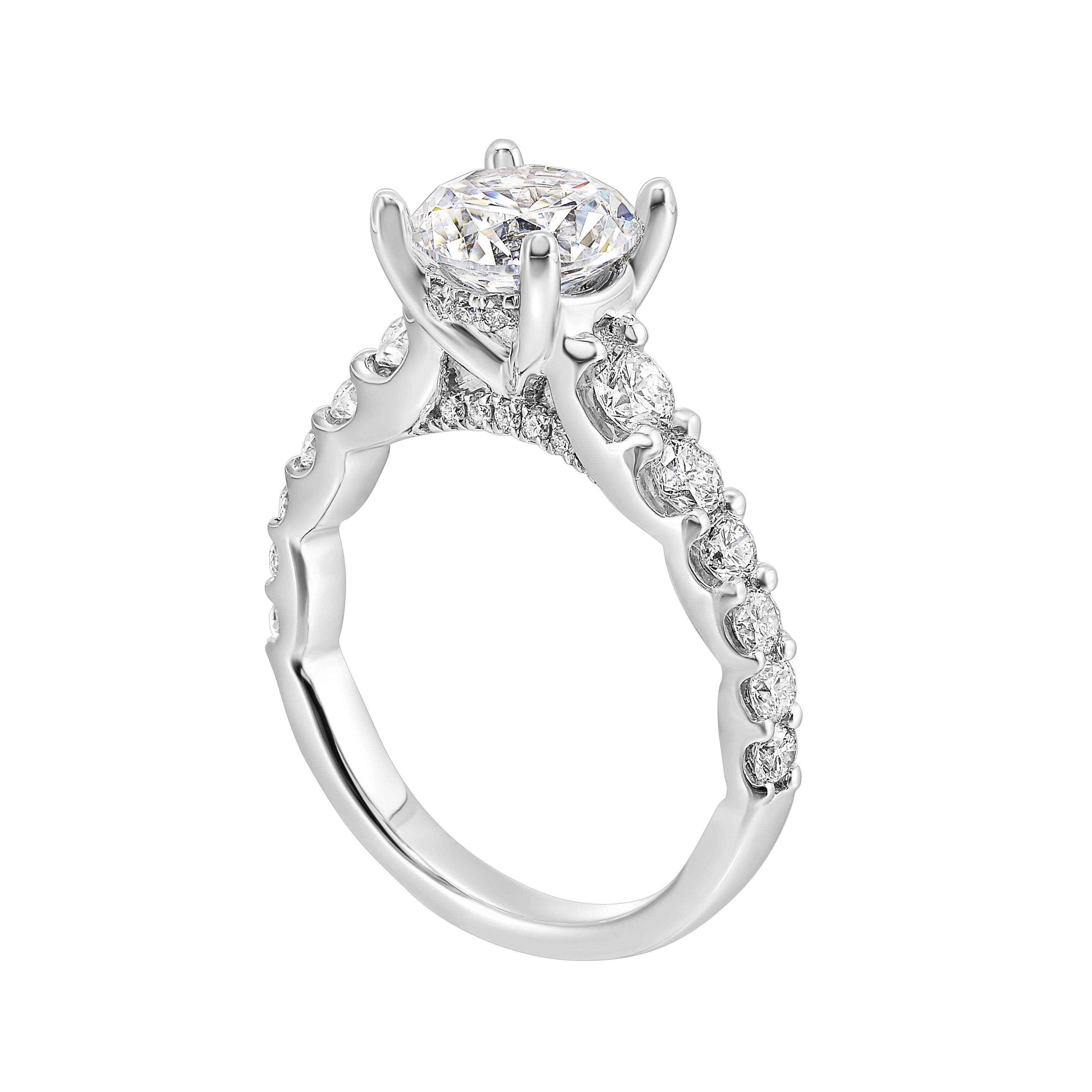 A classic round solitaire elevated by a graduating diamond shank set in common prong offers timeless elegance. Is perfect for your love story.