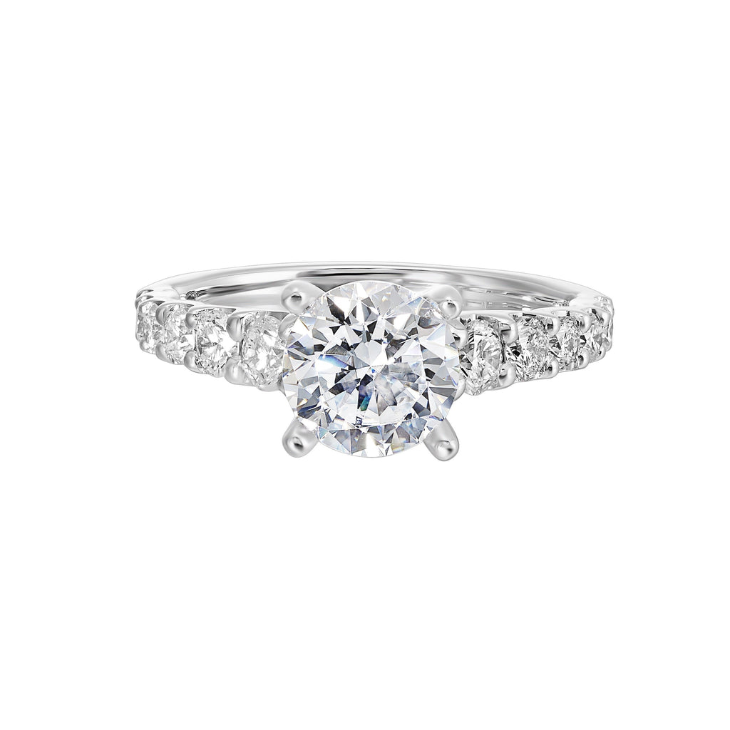 A classic round solitaire elevated by a graduating diamond shank set in common prong offers timeless elegance. Is perfect for your love story.