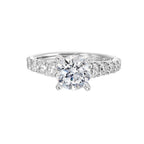 A classic round solitaire elevated by a graduating diamond shank set in common prong offers timeless elegance. Is perfect for your love story.