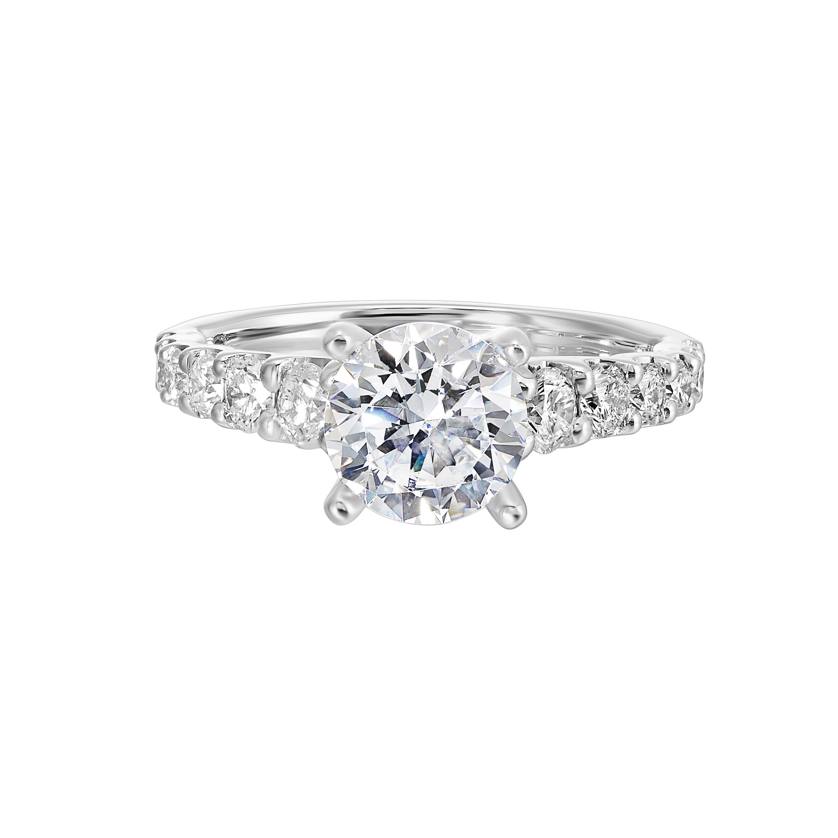 A classic round solitaire elevated by a graduating diamond shank set in common prong offers timeless elegance. Is perfect for your love story.