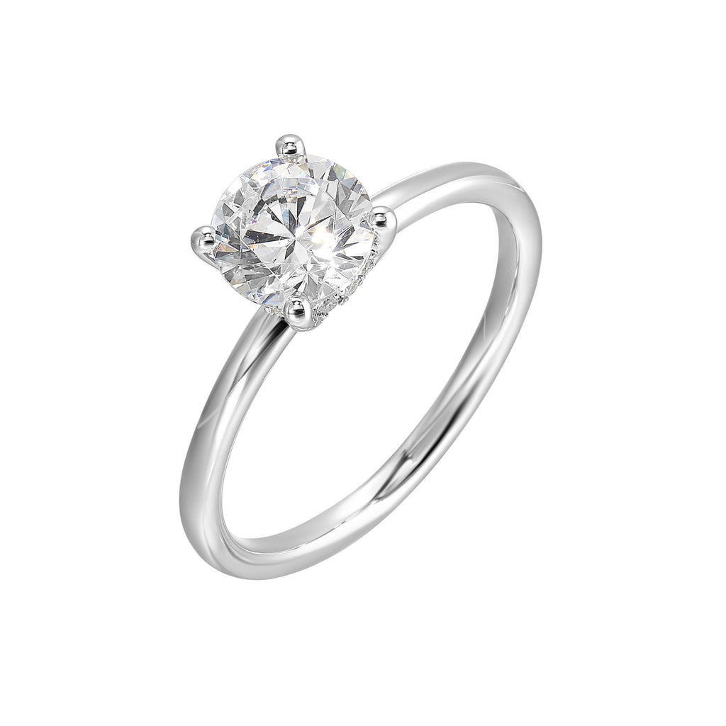 The dazzling solitaire diamond take center stage. The petite band adds to the sleek, classic look.