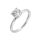 The dazzling solitaire diamond take center stage. The petite band adds to the sleek, classic look.