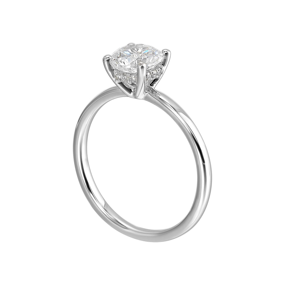 The dazzling solitaire diamond take center stage. The petite band adds to the sleek, classic look.