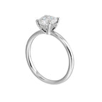The dazzling solitaire diamond take center stage. The petite band adds to the sleek, classic look.