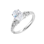 Immerse yourself in the enchanting beauty of this engagement ring highlighting the oval center and unique diamond setting in shank.