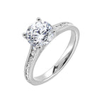 The simplicity of this single row channel set diamond shank engagement ring with four prong solitaire is simply gorgeous.