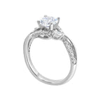 A nature inspired twist on the classic three stone ring. This ring features interwined look with play of pave diamonds and metal.