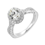 Shimmers of entwined shank with a classic halo and round center diamond is sure to delight you.