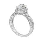 Shimmers of entwined shank with a classic halo and round center diamond is sure to delight you.