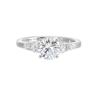 Five times diamonds for five times sparkles. A classic, lustrous band completes the look of this five stone engagement ring.