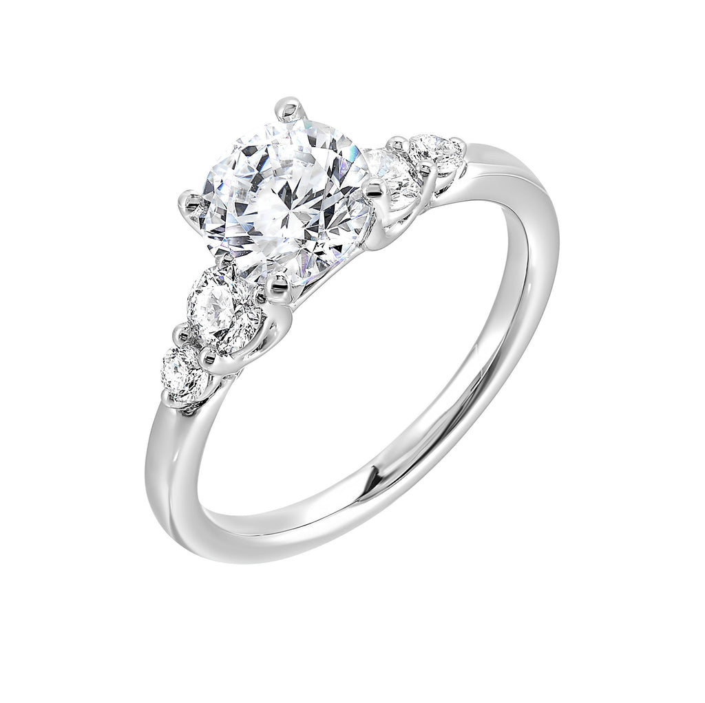 Five times diamonds for five times sparkles. A classic, lustrous band completes the look of this five stone engagement ring.