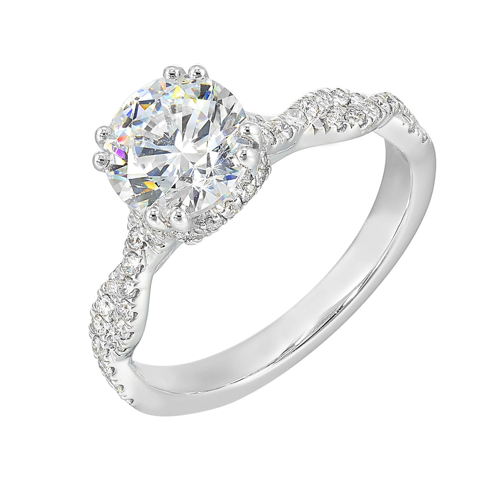 Stunning with a round solitaire diamond set in dual prongs atop a modern crisscross band. The unique twist on timeless elegance is perfect for the modern bride.