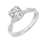 Stunning with a round solitaire diamond set in dual prongs atop a modern crisscross band. The unique twist on timeless elegance is perfect for the modern bride.