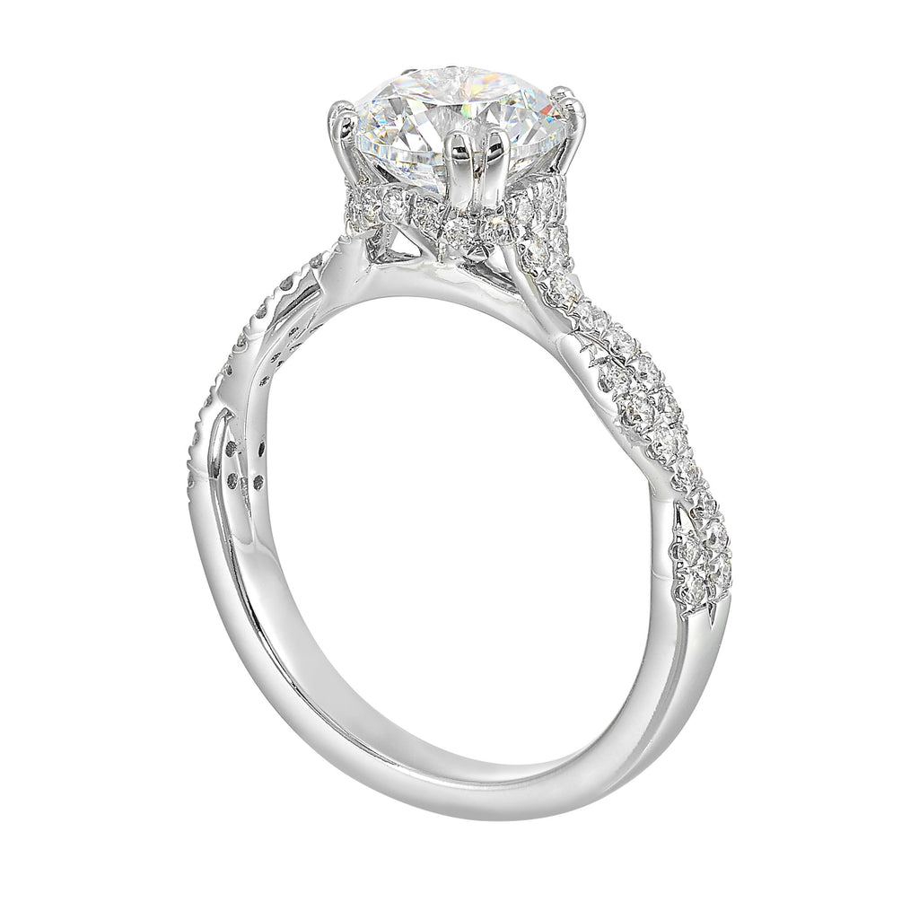 Stunning with a round solitaire diamond set in dual prongs atop a modern crisscross band. The unique twist on timeless elegance is perfect for the modern bride.