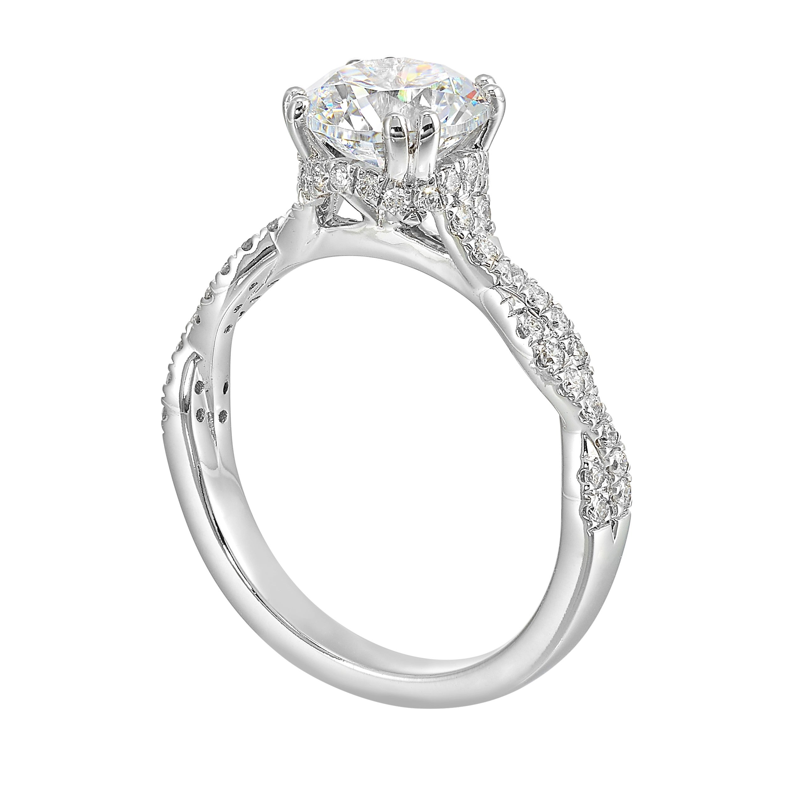 Stunning with a round solitaire diamond set in dual prongs atop a modern crisscross band. The unique twist on timeless elegance is perfect for the modern bride.