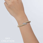 0.24CT 14K Y/G DIAMOND PAVE RIBBED BANGLE
